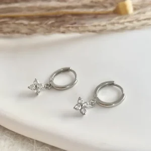 Delicate Silver Huggie Hoops featuring an everyday sterling silver earring stack set designed for multiple piercings – the perfect gift idea for her